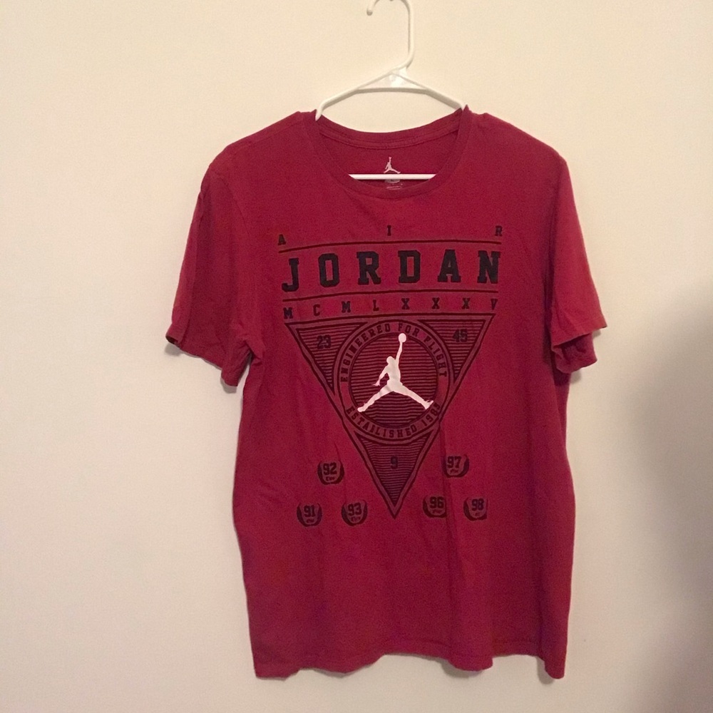 I’m selling a red black and white Air Jordan shirt